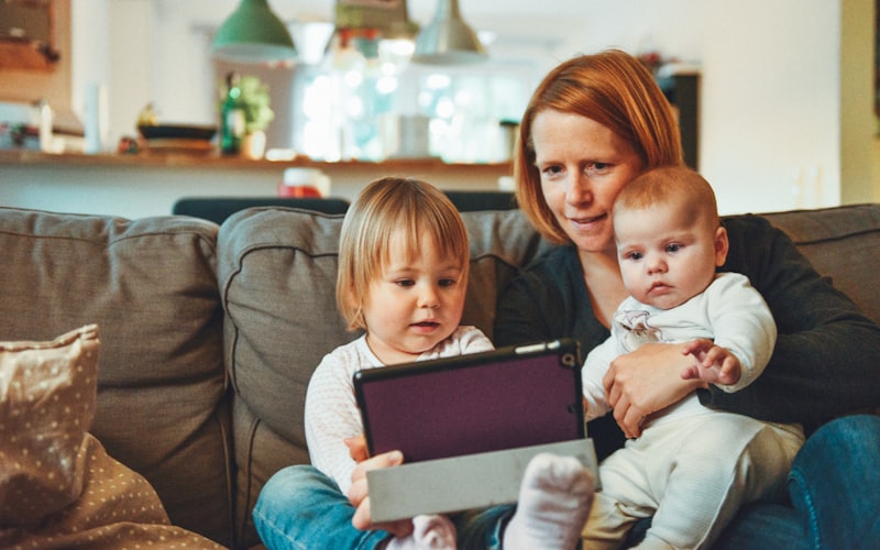 A parent at home with two young children