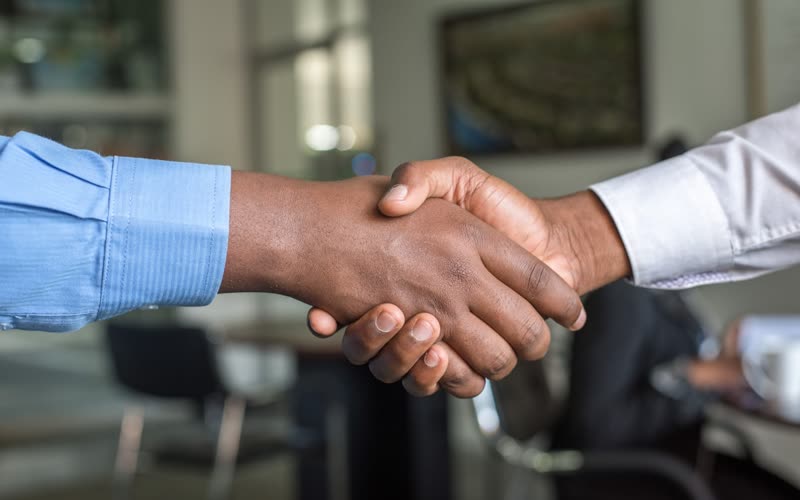 A handshake closing a commercial deal