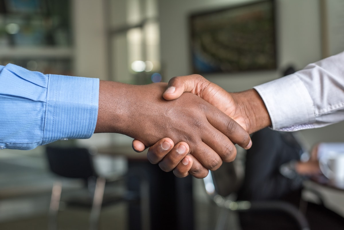 A handshake closing a commercial deal