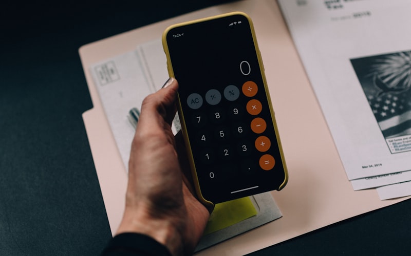 A calculator and paperwork on a desk